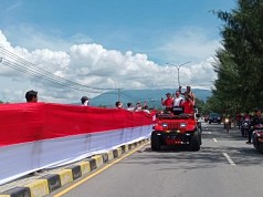 MURI : Pembentangan Bendera Merah Putih Sepanjang 10 Km di Kota Jayapura Raih Rekor Dunia MURI : Pembentangan Bendera Merah Putih Sepanjang 10 Km di Kota Jayapura Raih Rekor Dunia
