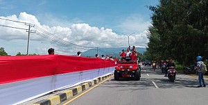 MURI : Pembentangan Bendera Merah Putih Sepanjang 10 Km di Kota Jayapura Raih Rekor Dunia